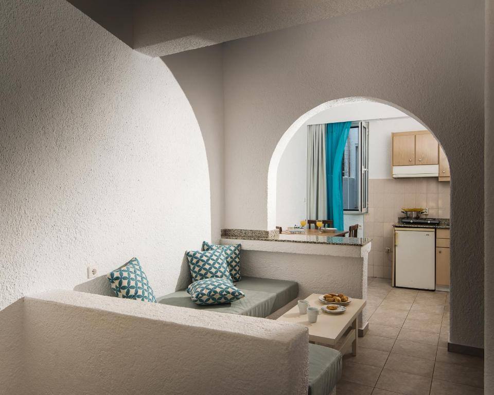 Open plan living area with kitchenette in an apartment